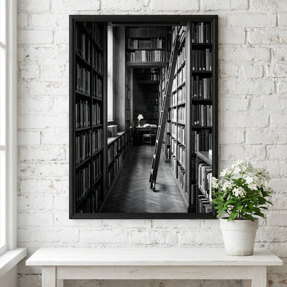 Wall decor featuring black and white photograph of library aisle with ladder and glowing reading lamp