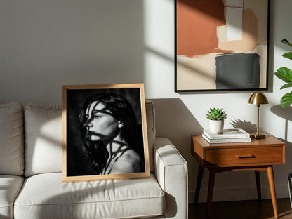 Black and white portrait wall decor of model lit by patterned gobo casting shadows