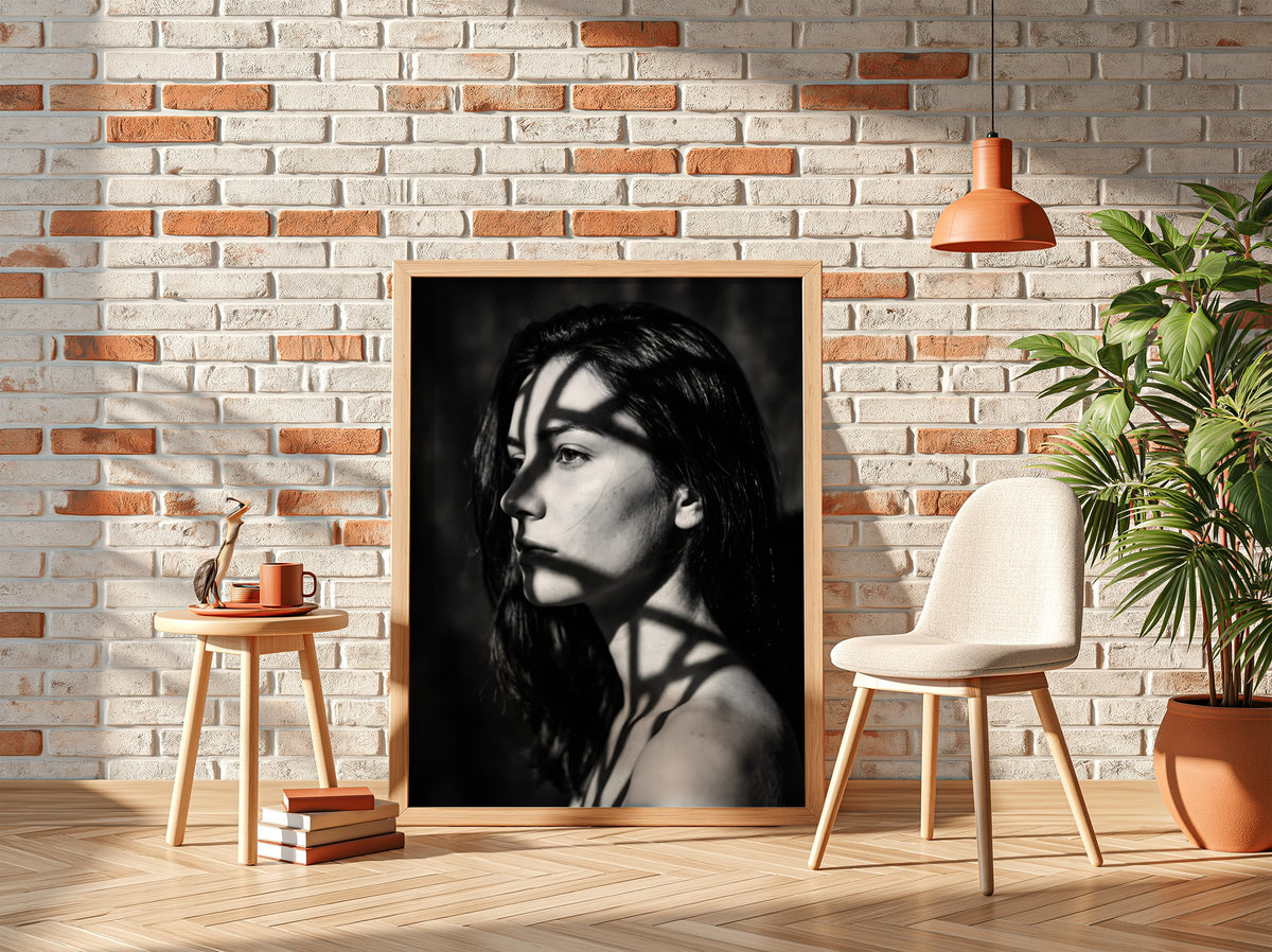 Black and white portrait wall decor of model lit by patterned gobo casting shadows