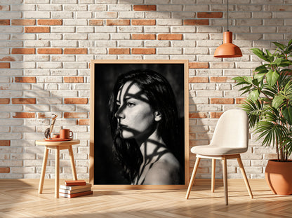 Black and white portrait wall decor of model lit by patterned gobo casting shadows