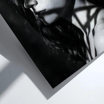 Black and white portrait wall decor of model lit by patterned gobo casting shadows