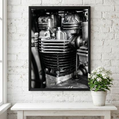 Wall decor featuring black and white close-up photo of motorcycle engine cylinder with metal textures