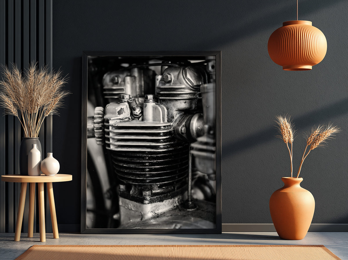 Wall decor featuring black and white close-up photo of motorcycle engine cylinder with metal textures
