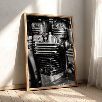 Wall decor featuring black and white close-up photo of motorcycle engine cylinder with metal textures