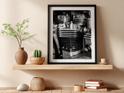 Wall decor featuring black and white close-up photo of motorcycle engine cylinder with metal textures