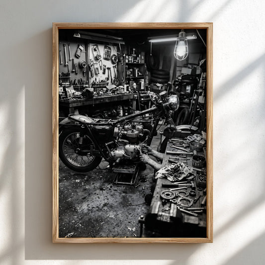 Vintage wall decor featuring black and white motorcycle in cluttered garage with tools and hanging light