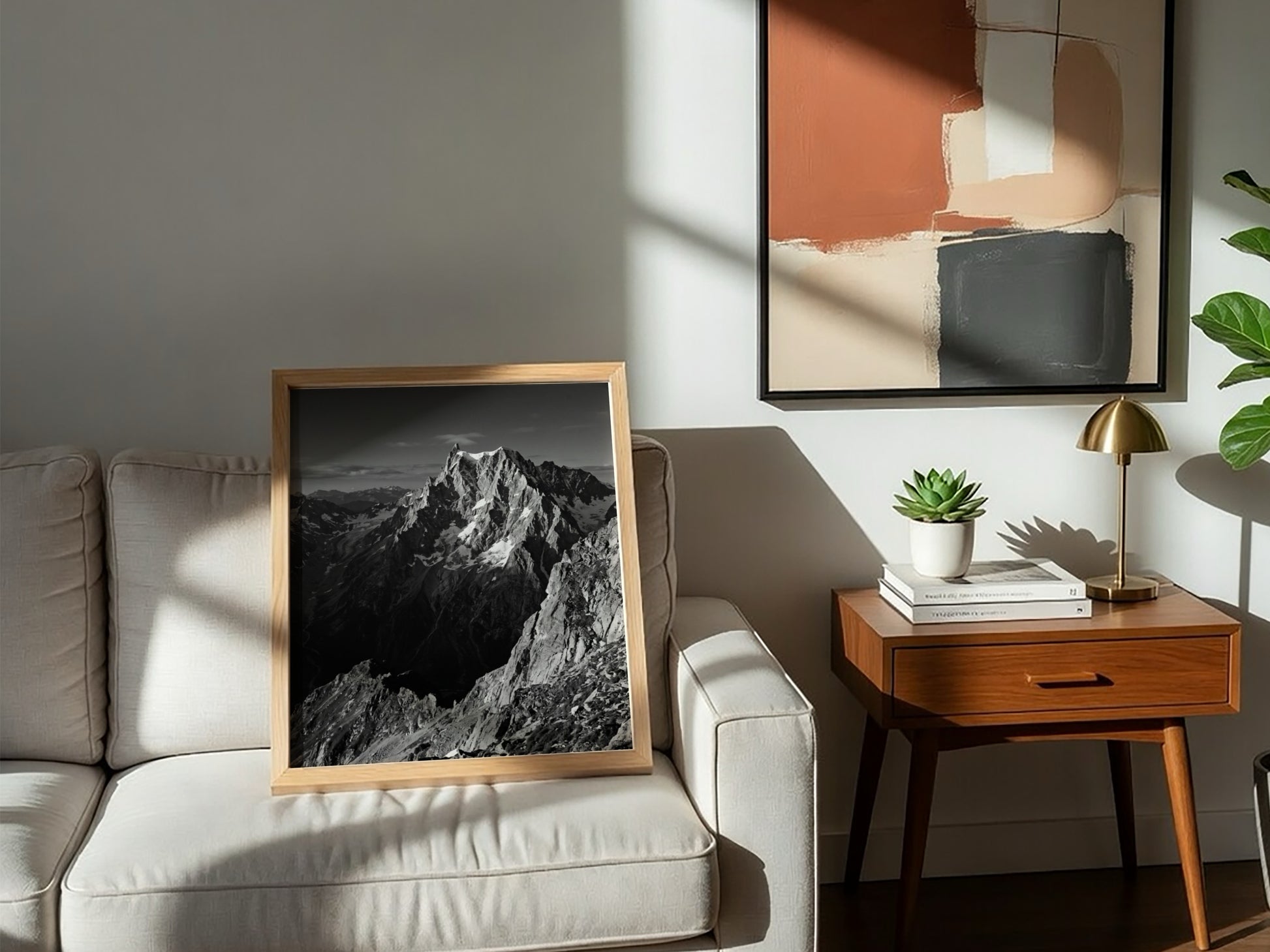 Black and white poster of mountain peak catching light with rugged rocky texture