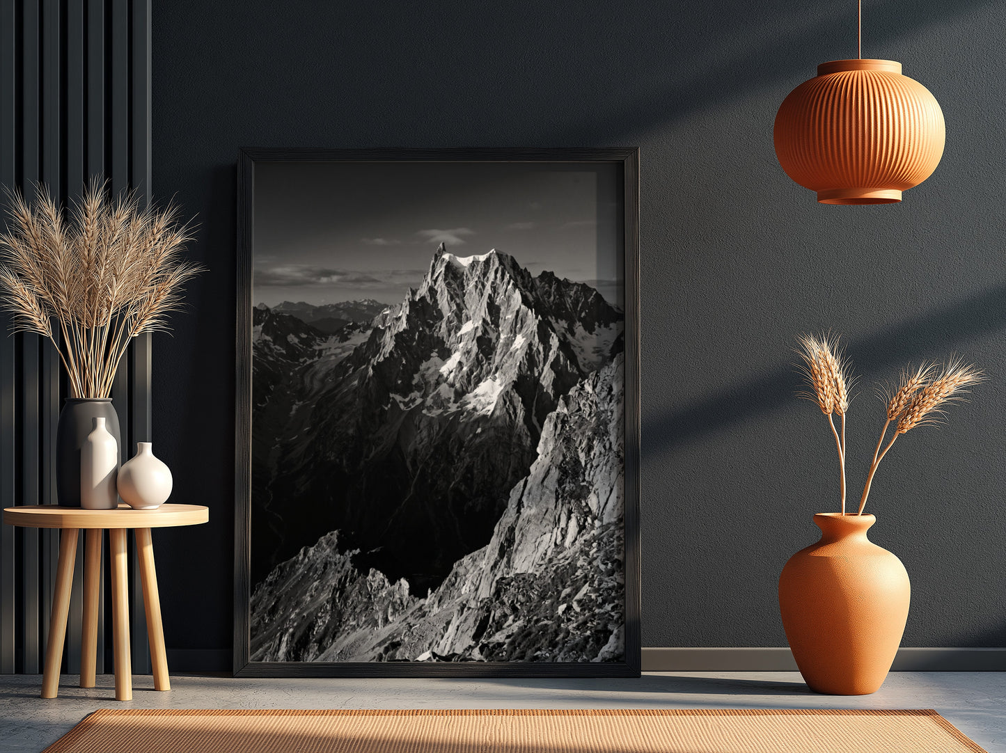 Black and white poster of mountain peak catching light with rugged rocky texture