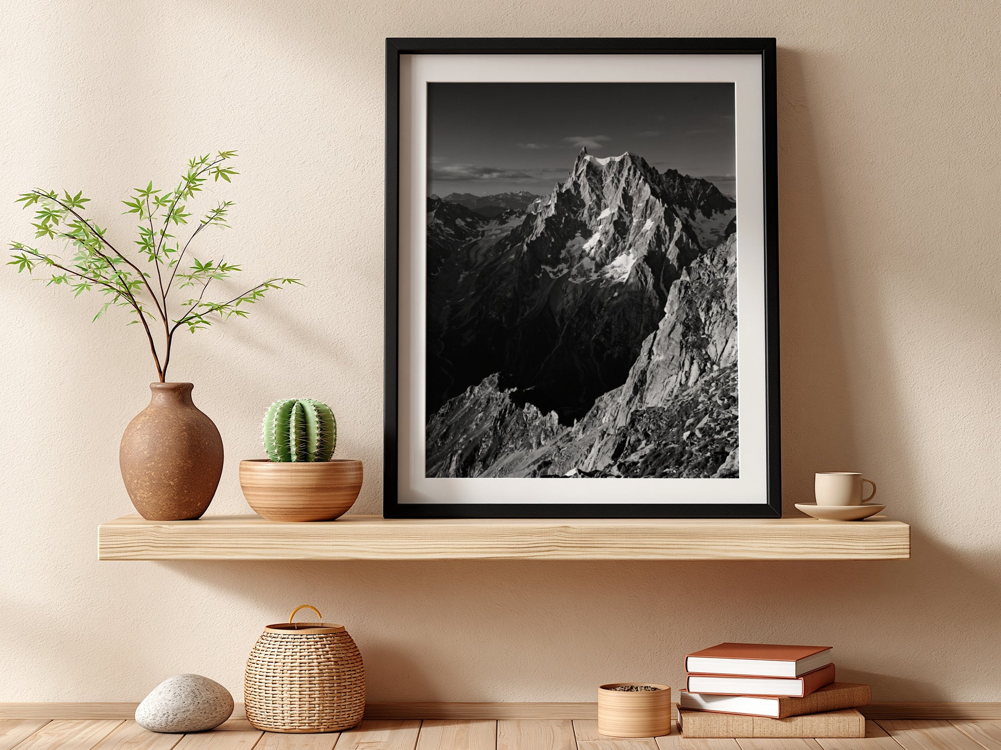 Black and white poster of mountain peak catching light with rugged rocky texture
