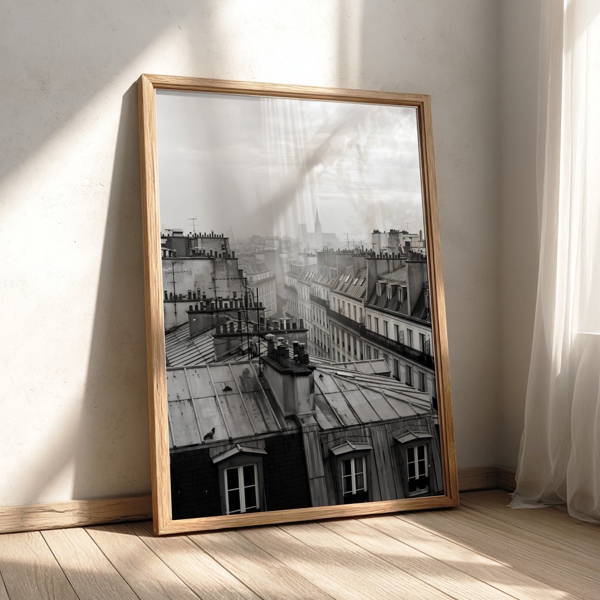 poster showing monochrome Parisian rooftops at dawn with soft light and misty skyline