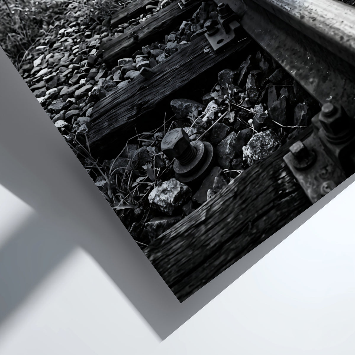 Black and white poster of railway tracks converging with wooden sleepers and overhead power lines