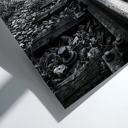 Black and white poster of railway tracks converging with wooden sleepers and overhead power lines