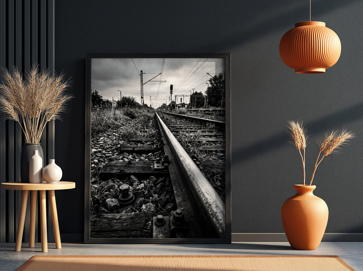 Black and white poster of railway tracks converging with wooden sleepers and overhead power lines