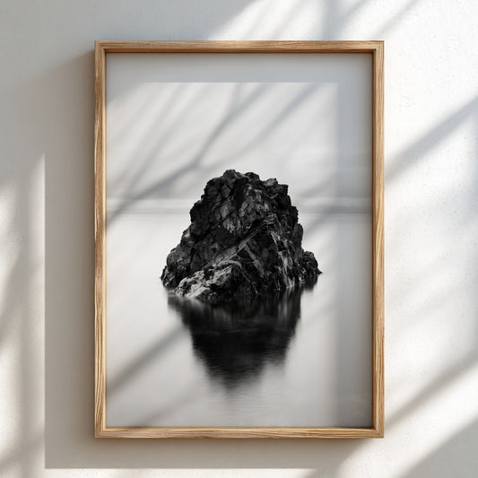minimalist wall decor of rock formation in still water black and white photography