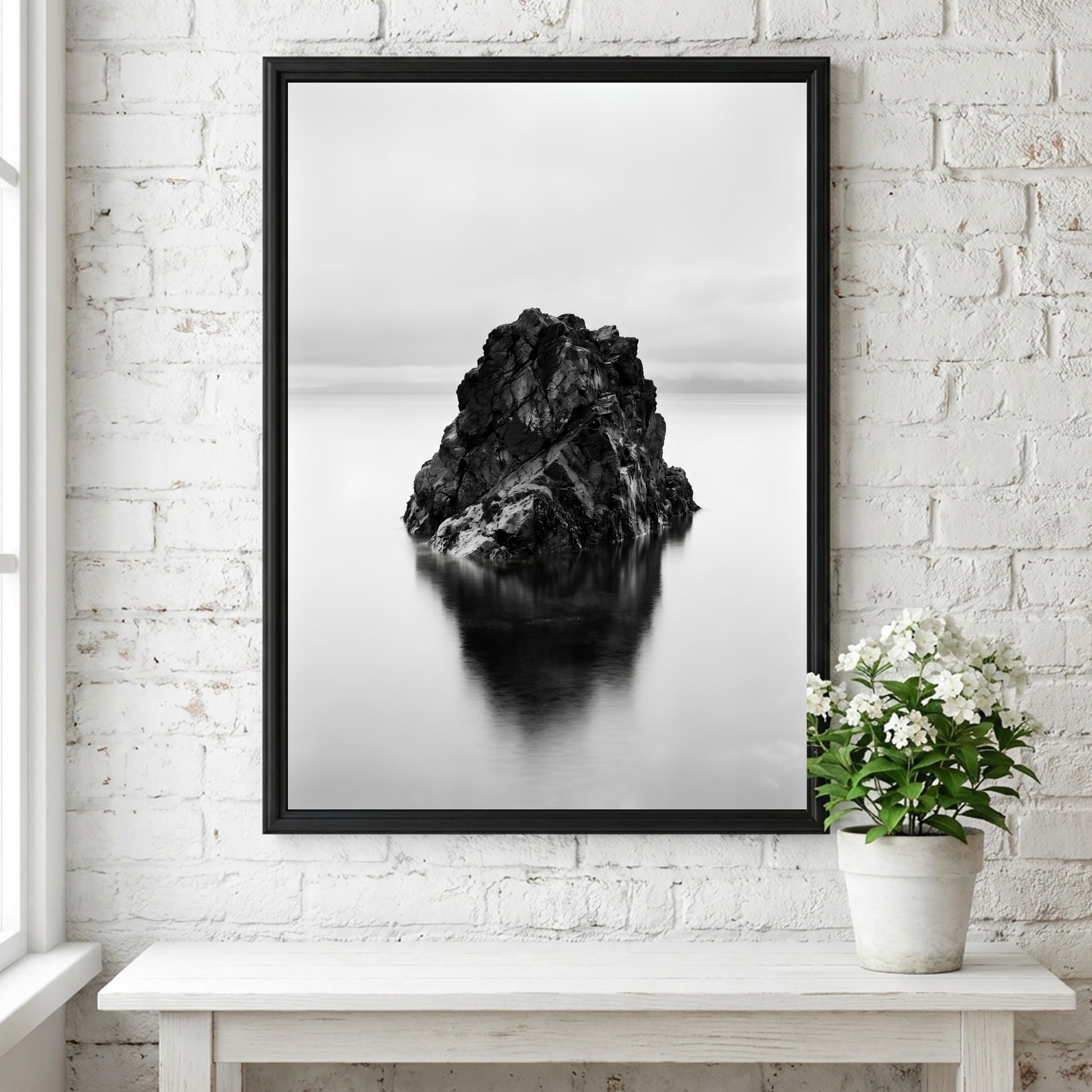 minimalist wall decor of rock formation in still water black and white photography