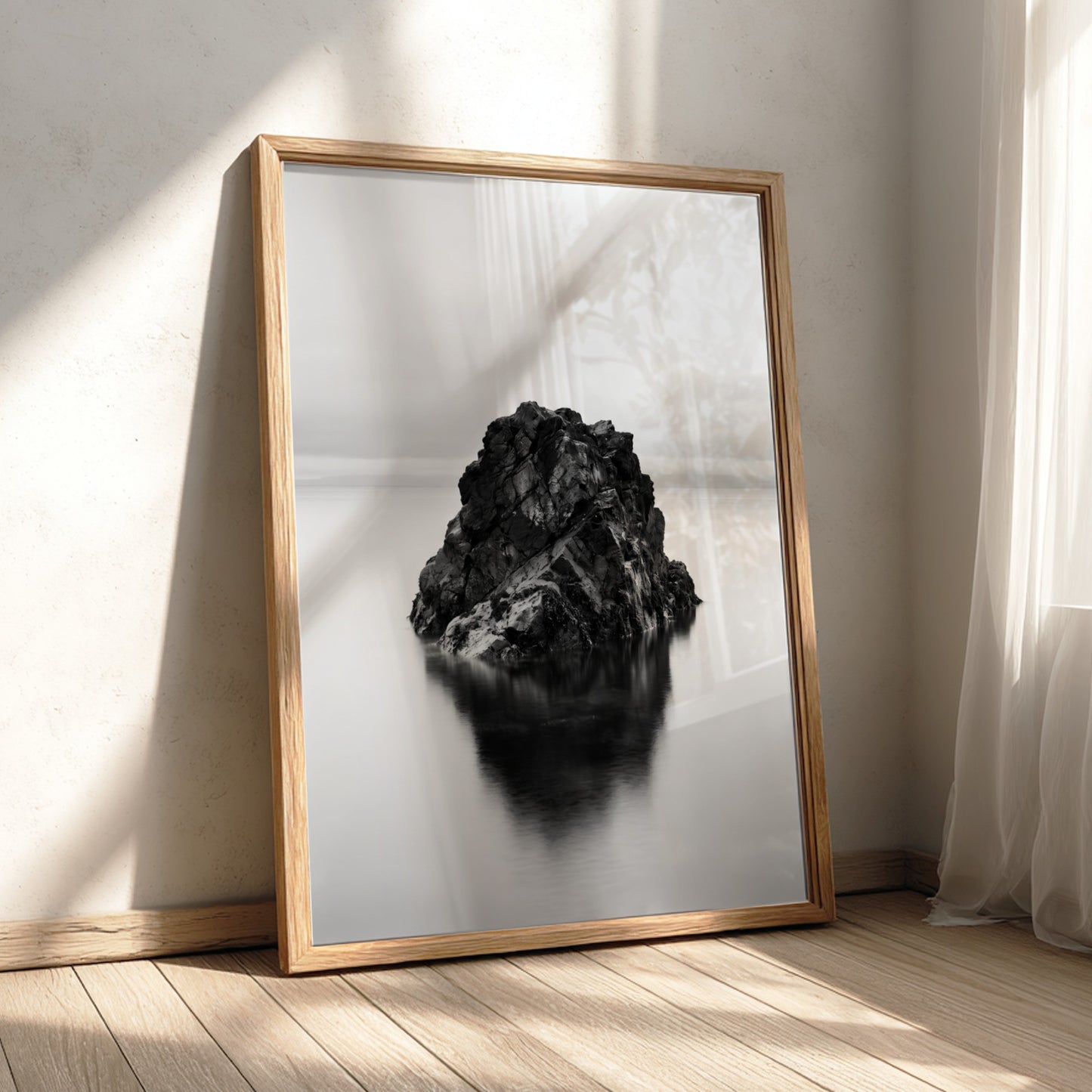 minimalist wall decor of rock formation in still water black and white photography