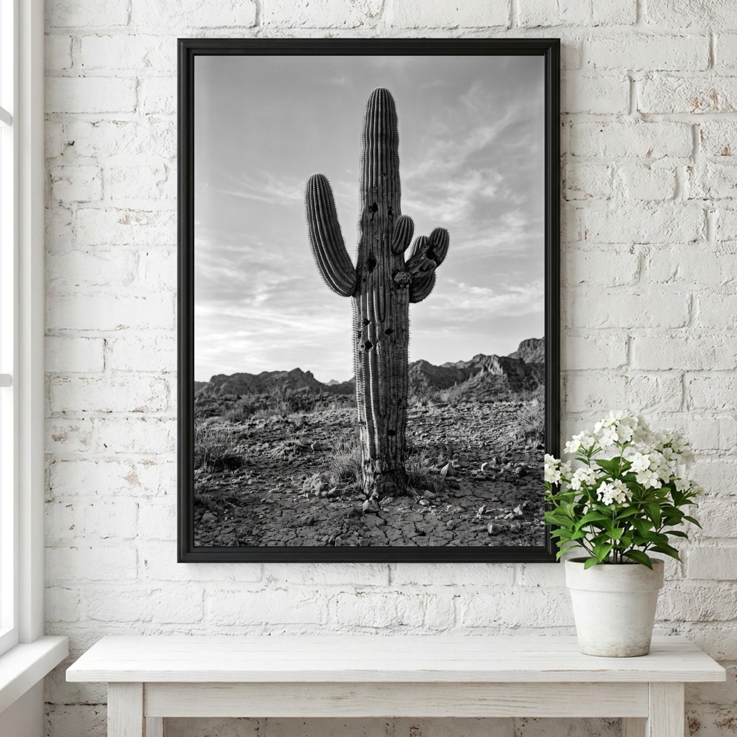 Poster of a monochrome saguaro cactus in desert with rocky ground and cloudy sky