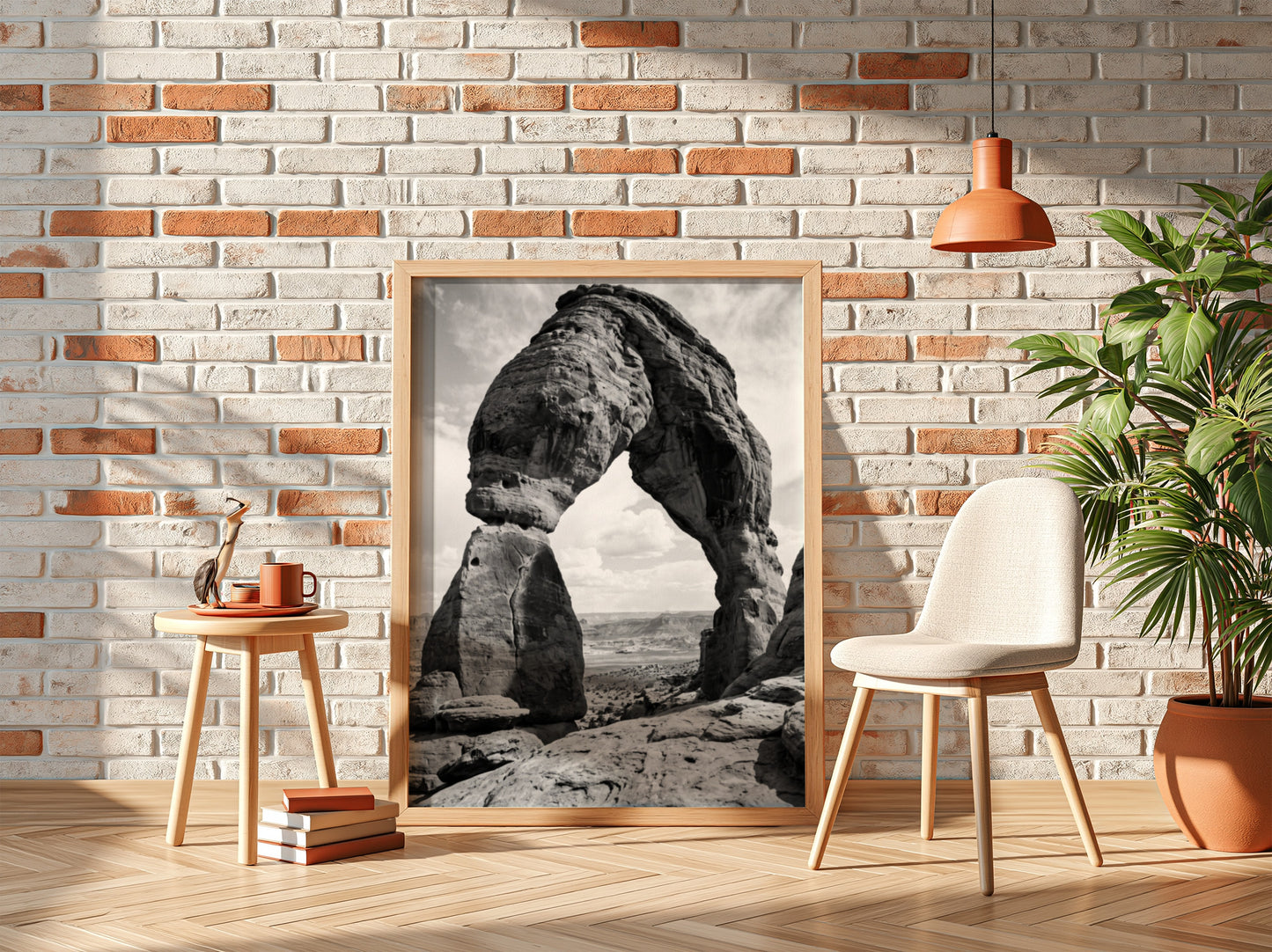Black and white wall decor of sandstone arch in desert with textured rock and cloudy sky