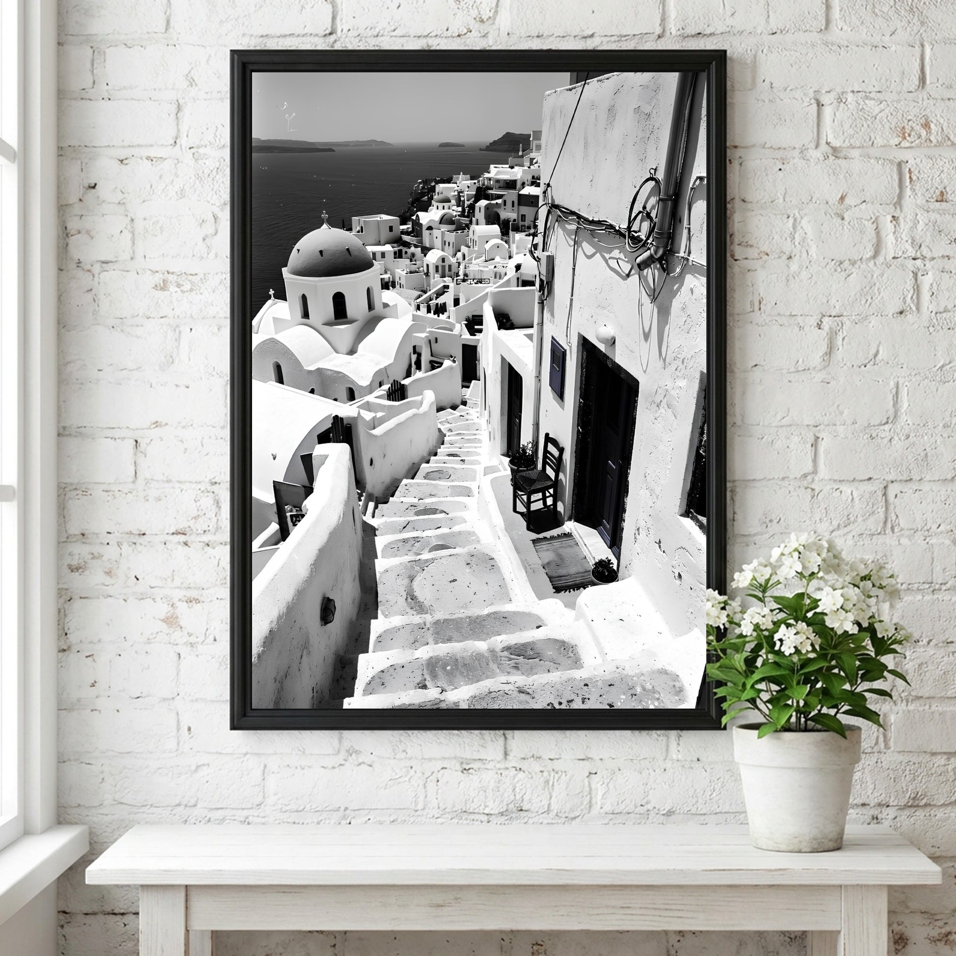 Black and white photography poster showing Santorini steps with white buildings and domed church