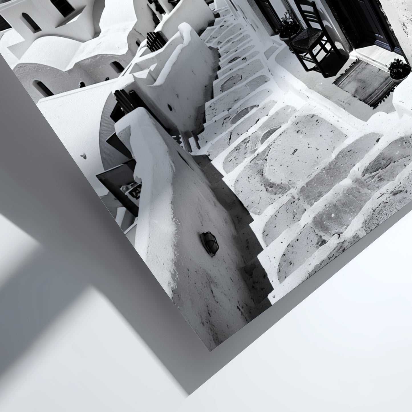 Black and white photography poster showing Santorini steps with white buildings and domed church
