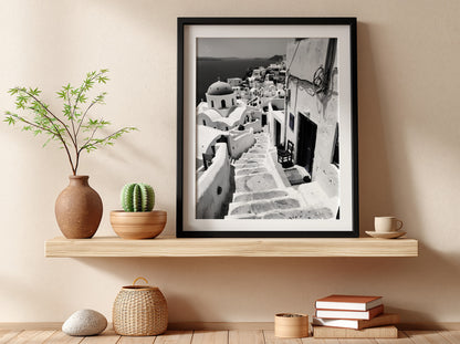 Black and white photography poster showing Santorini steps with white buildings and domed church