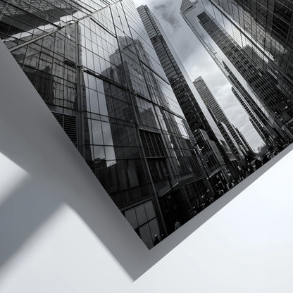 Wall decor featuring black-and-white urban photography of skyscrapers converging with reflective glass