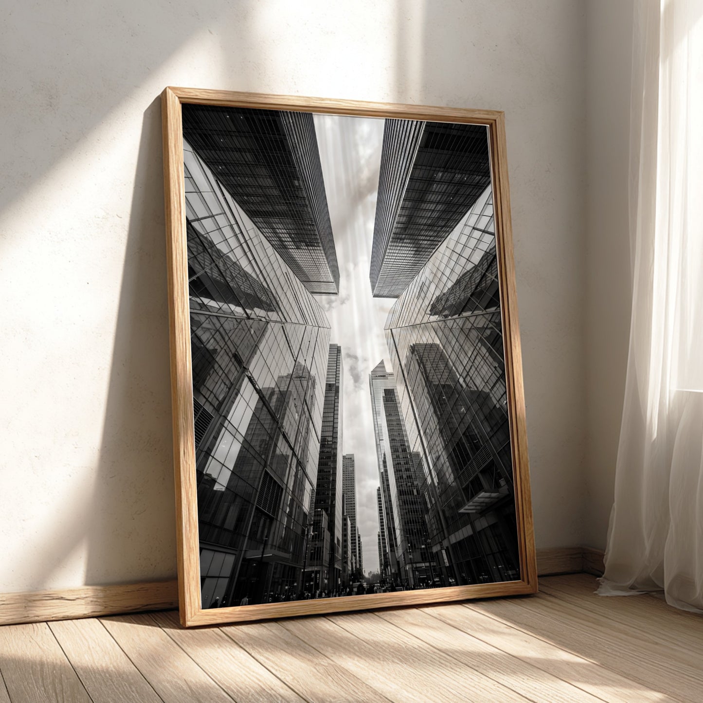 Wall decor featuring black-and-white urban photography of skyscrapers converging with reflective glass