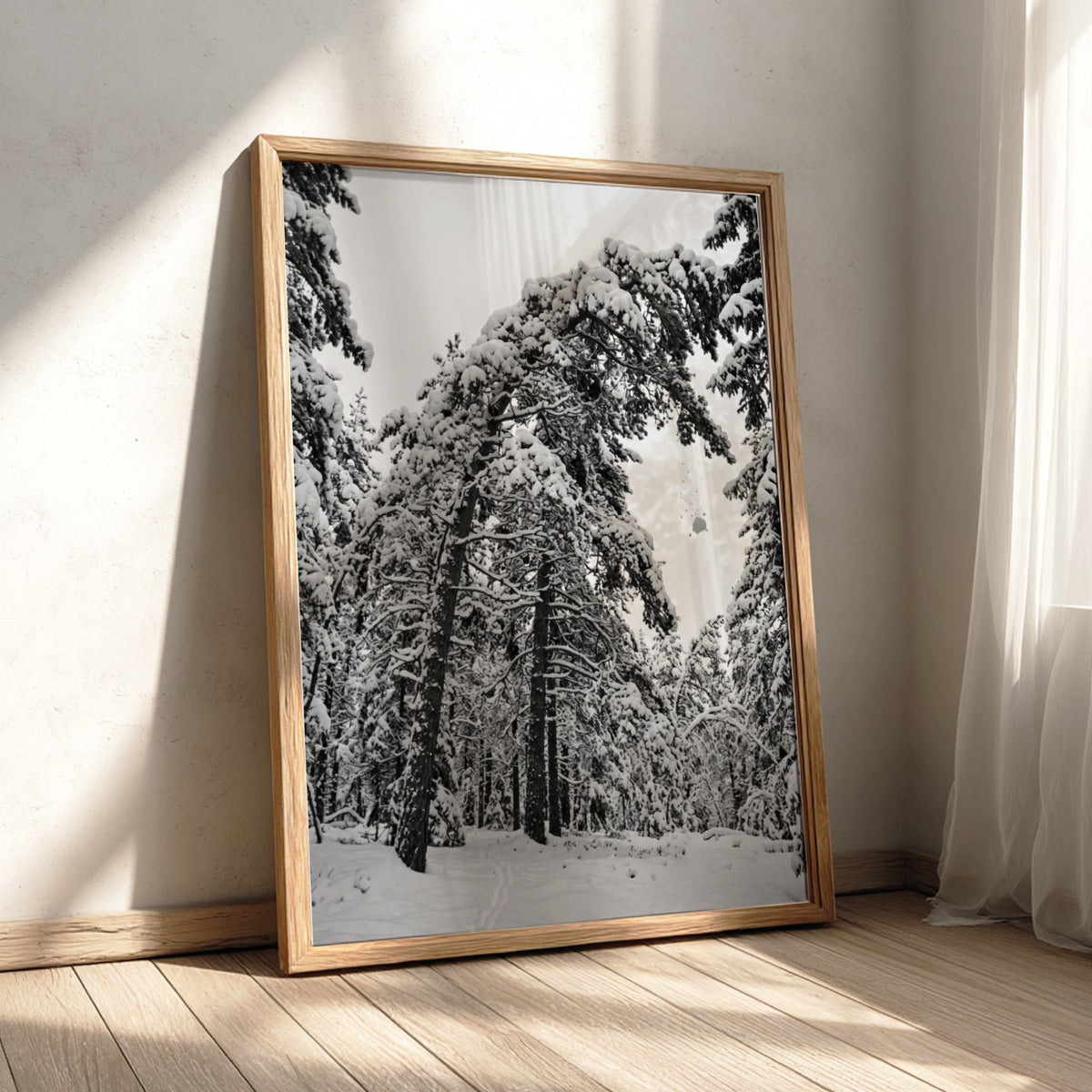 Poster of snow falling from pine trees in monochrome palette with snowy forest landscape