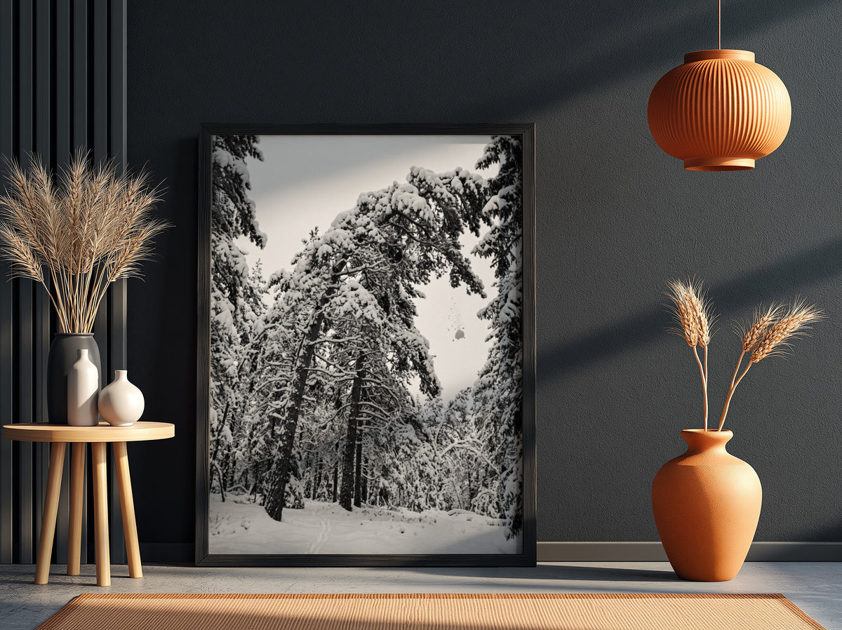 Poster of snow falling from pine trees in monochrome palette with snowy forest landscape