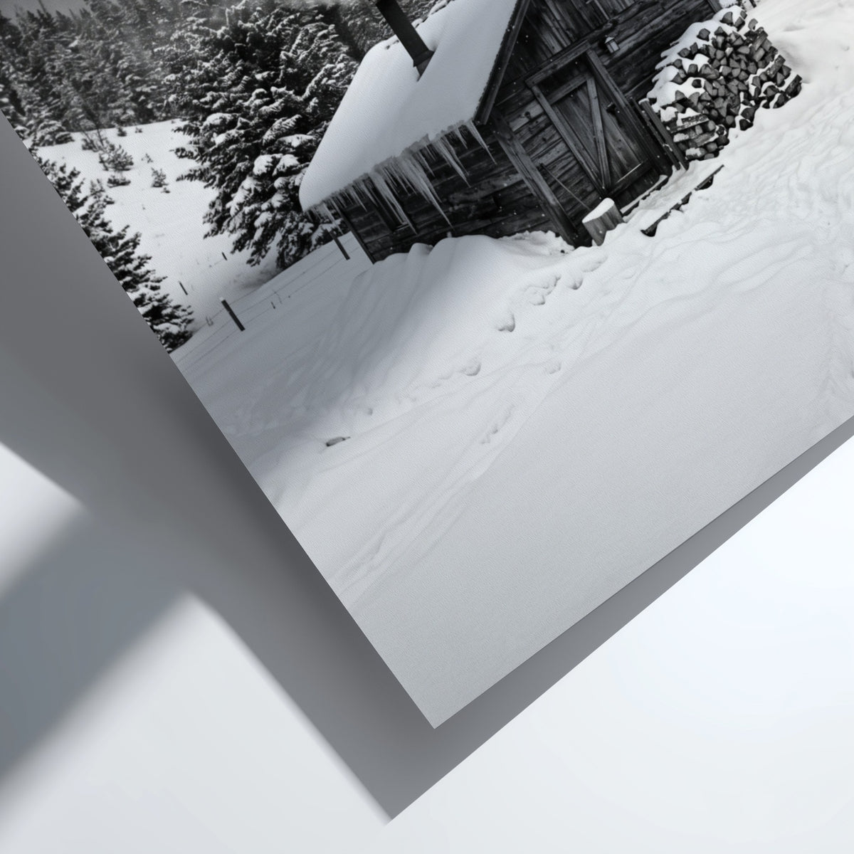 Wall decor showing snowy cabin with smoking chimney in grayscale winter forest landscape
