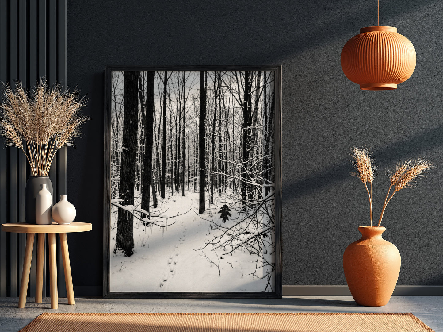 Framed wall decor showing a snowy forest winter landscape with tall bare trees and fresh white snow