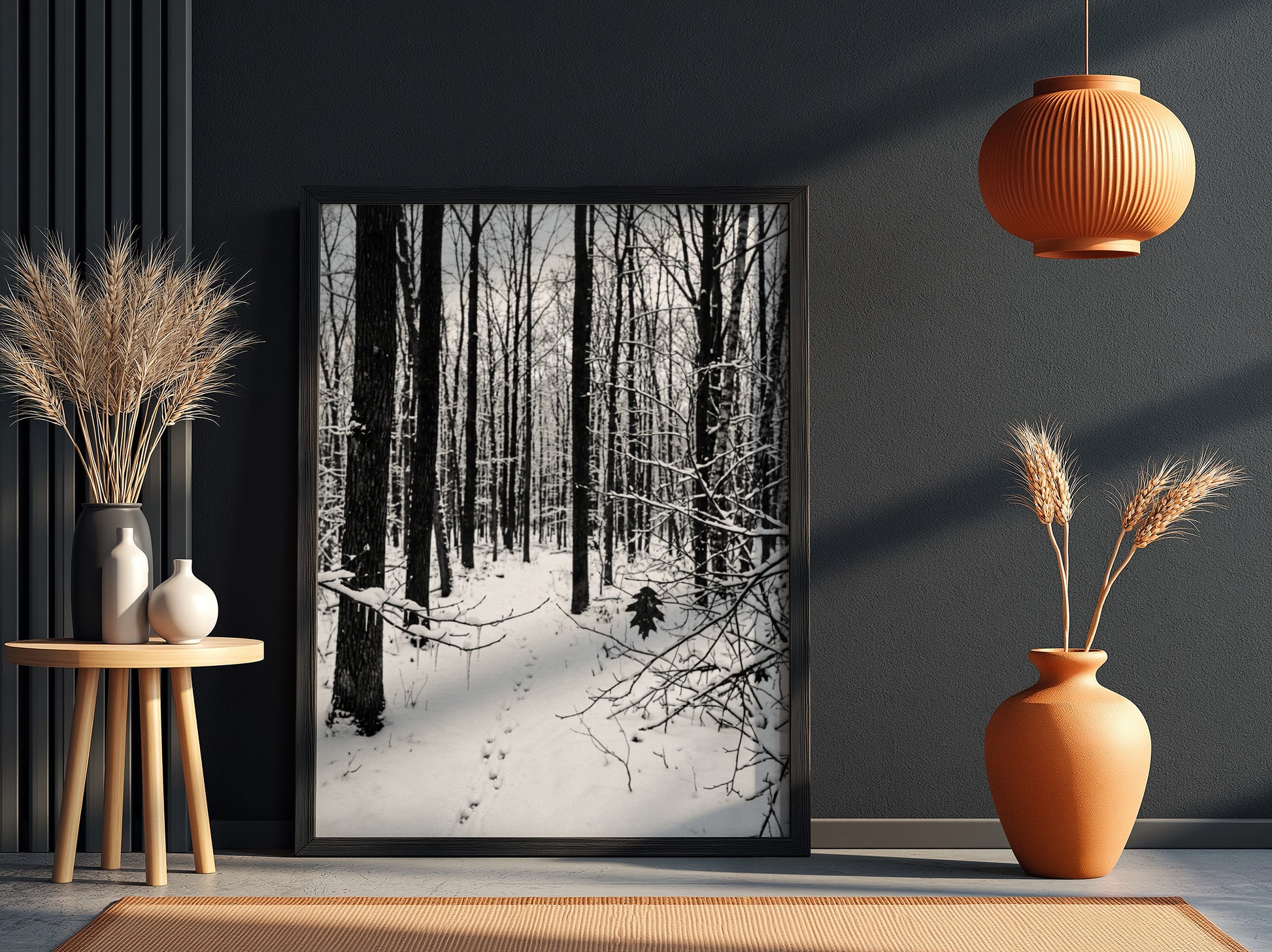 Framed wall decor showing a snowy forest winter landscape with tall bare trees and fresh white snow
