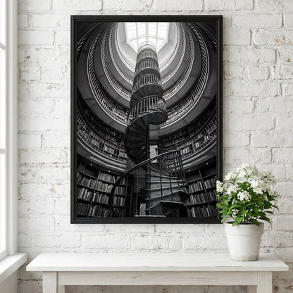 black and white poster featuring spiral staircase inside circular library with iron railings and skylight