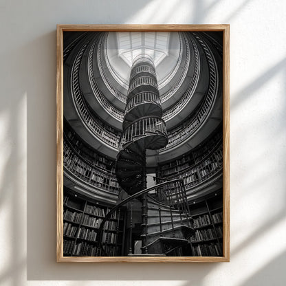 black and white poster featuring spiral staircase inside circular library with iron railings and skylight