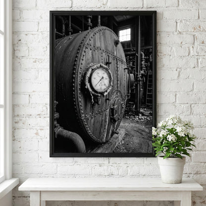 Poster of black and white steel boiler with gauge and rivets in industrial room setting