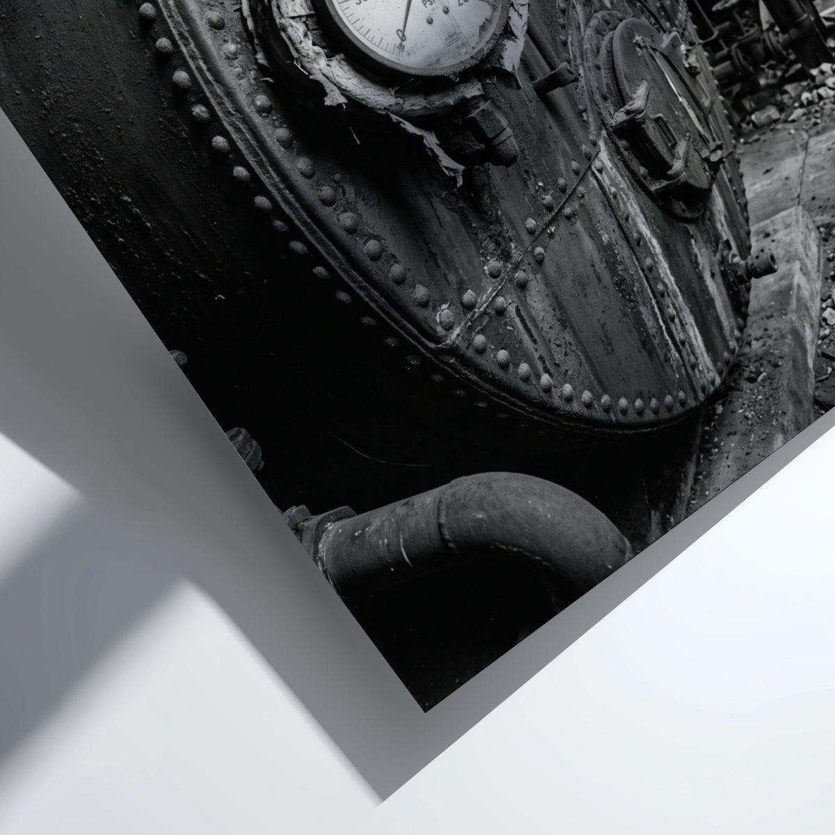 Poster of black and white steel boiler with gauge and rivets in industrial room setting