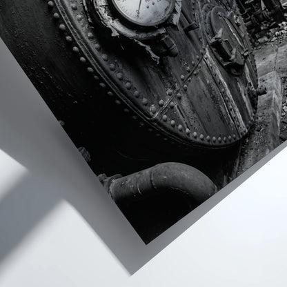 Poster of black and white steel boiler with gauge and rivets in industrial room setting