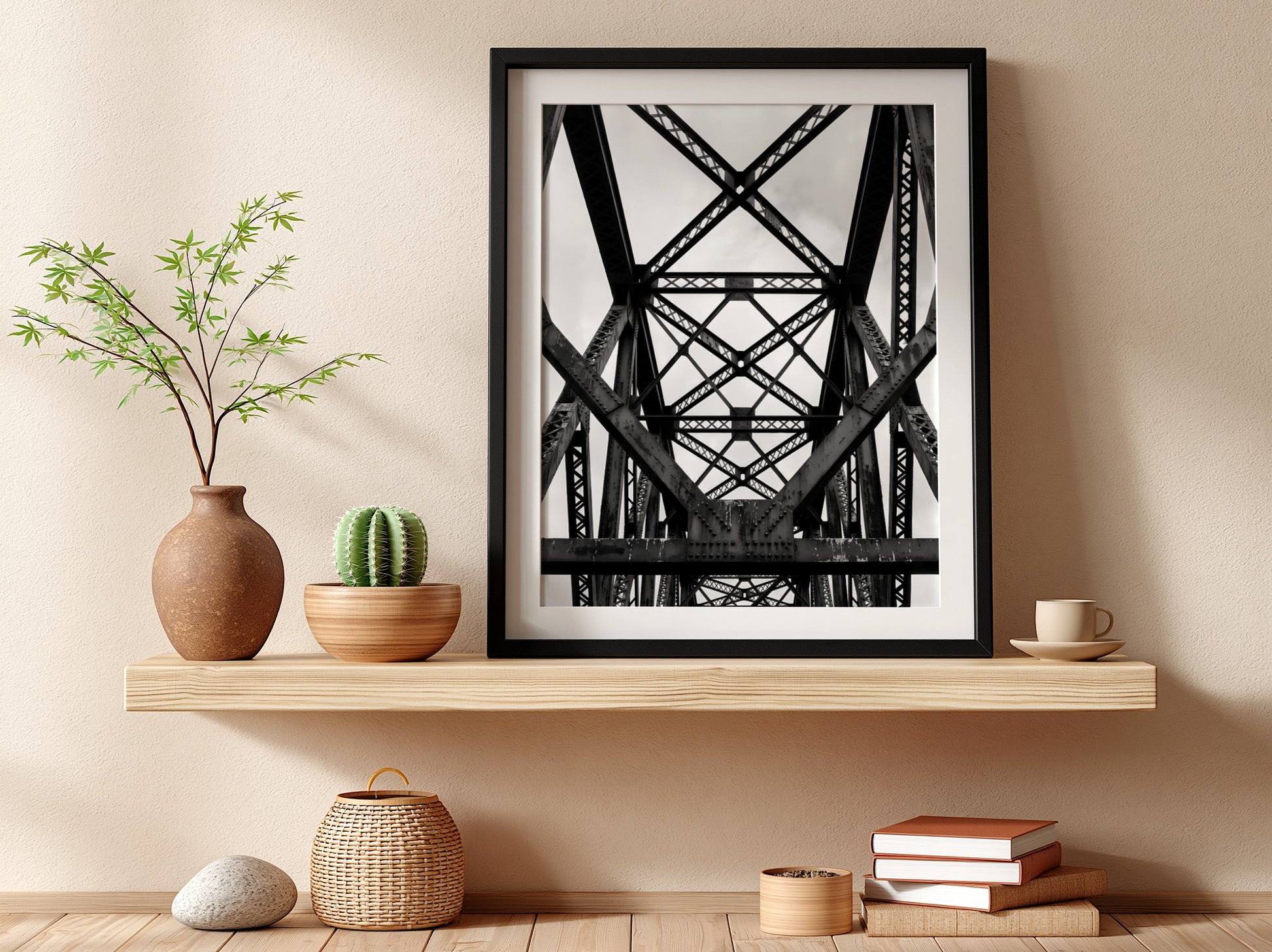 Black and white wall decor featuring steel bridge trusses with geometric patterns and strong shadows