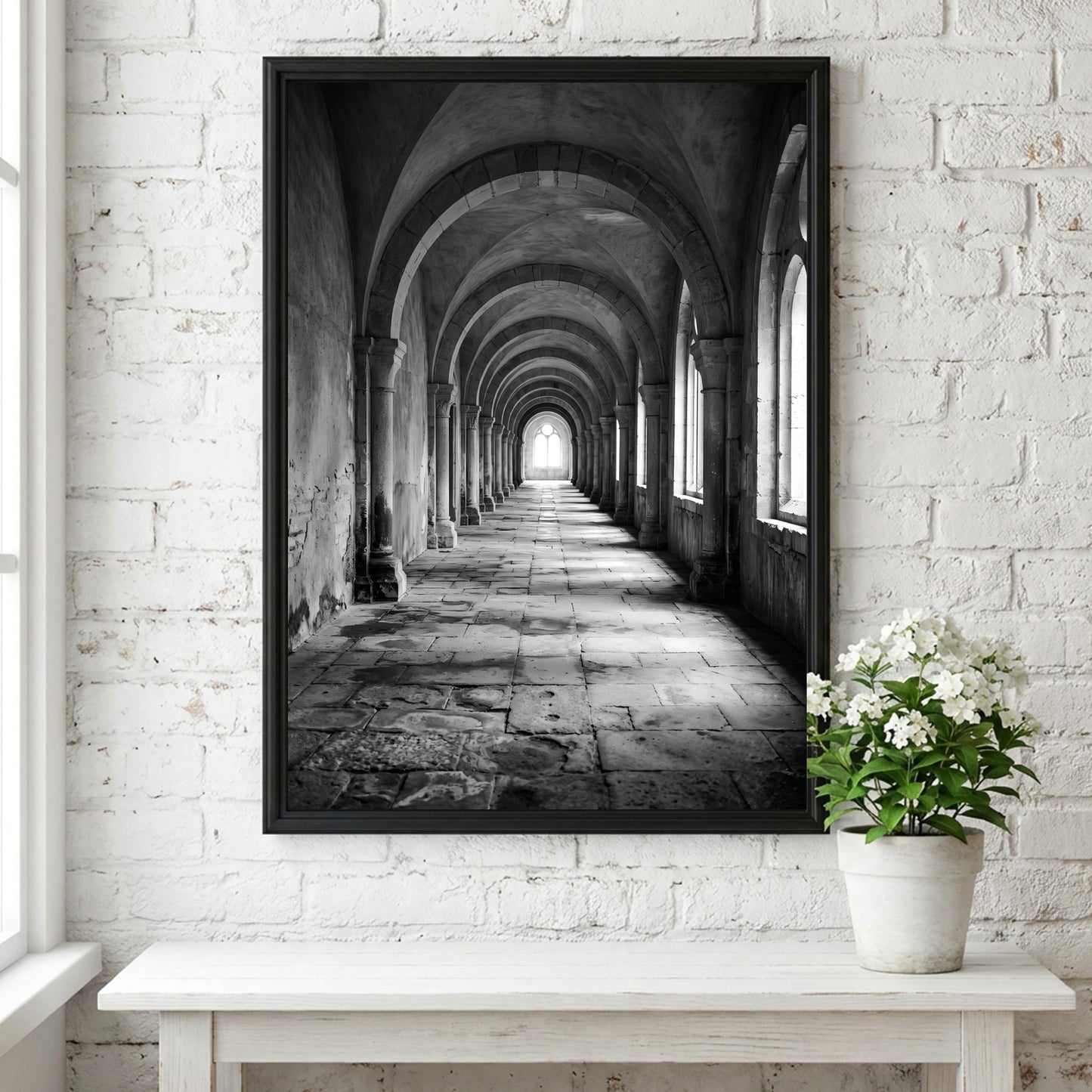 Black and white wall decor of stone corridor with rounded arches and textured stone floor