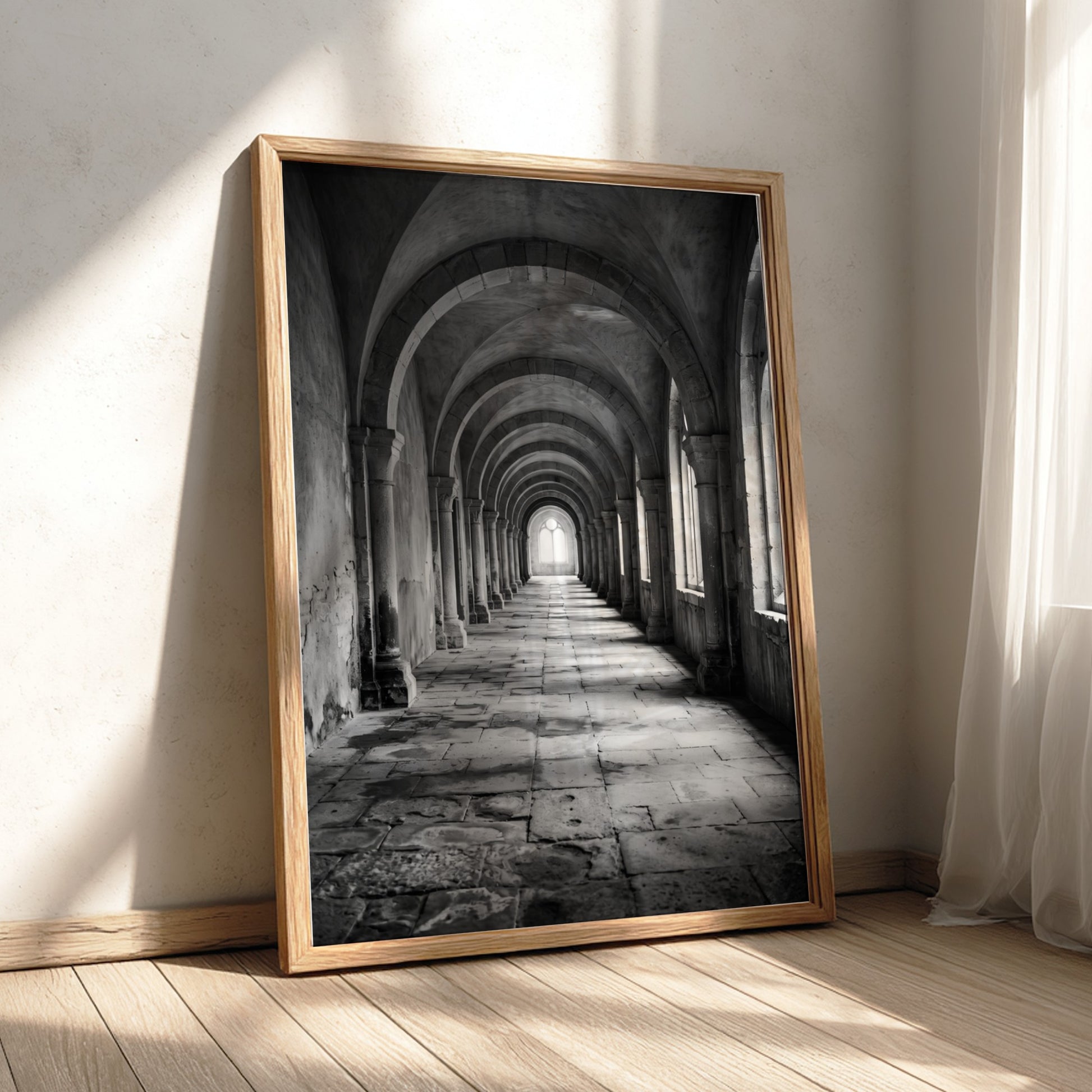 Black and white wall decor of stone corridor with rounded arches and textured stone floor