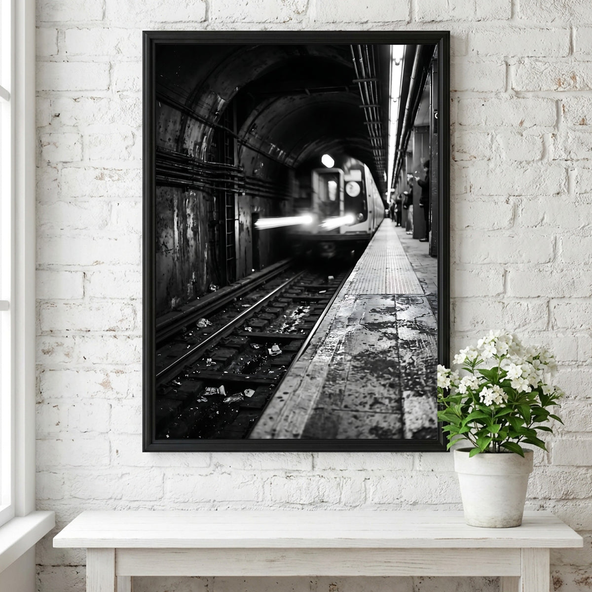 Black and white poster of subway train approaching tunnel with gritty urban textures and blurred motion