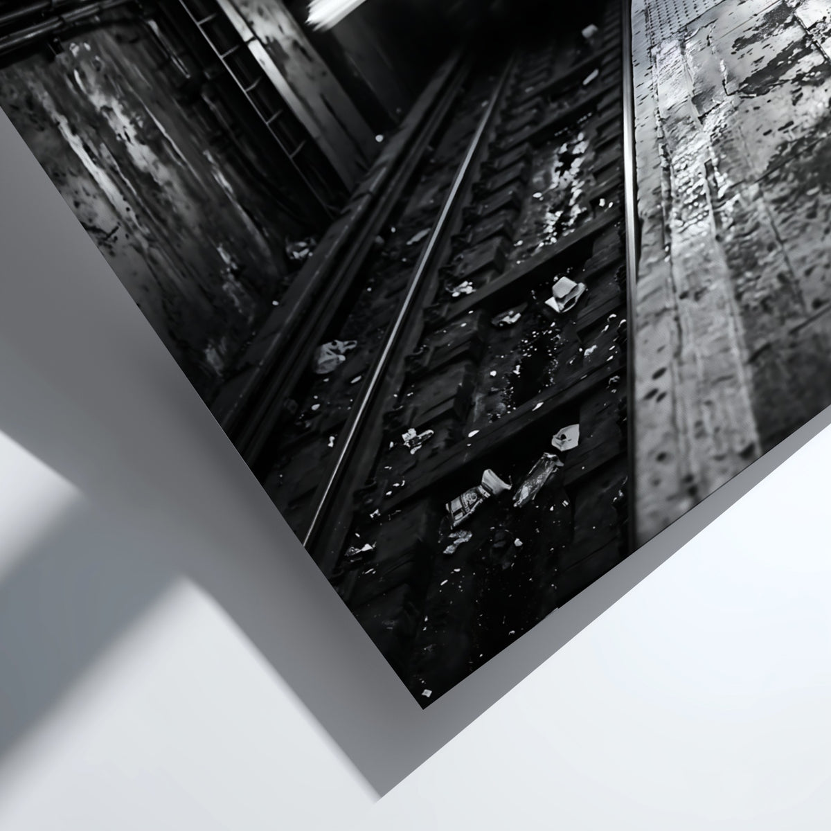Black and white poster of subway train approaching tunnel with gritty urban textures and blurred motion