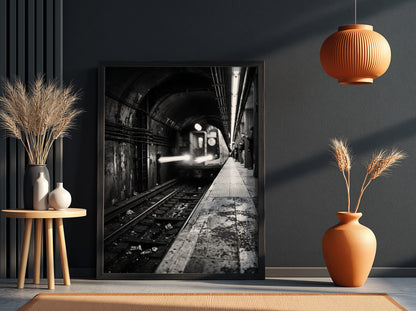 Black and white poster of subway train approaching tunnel with gritty urban textures and blurred motion