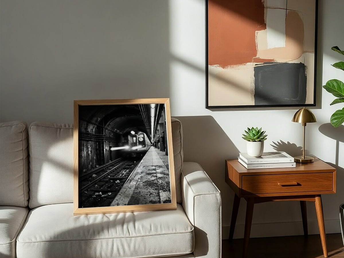 Black and white poster of subway train approaching tunnel with gritty urban textures and blurred motion
