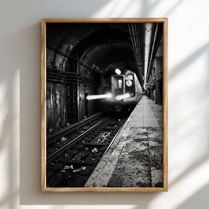 Black and white poster of subway train approaching tunnel with gritty urban textures and blurred motion
