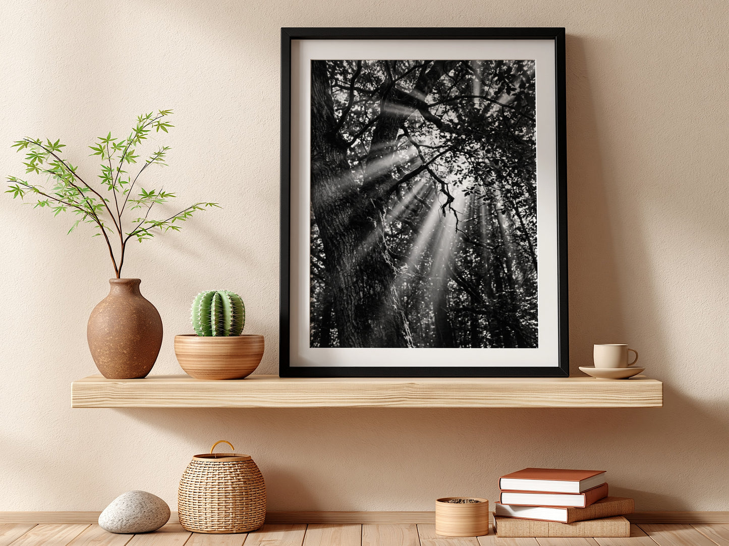 Black and white wall decor showing sunlight beams breaking through dense forest trees and branches