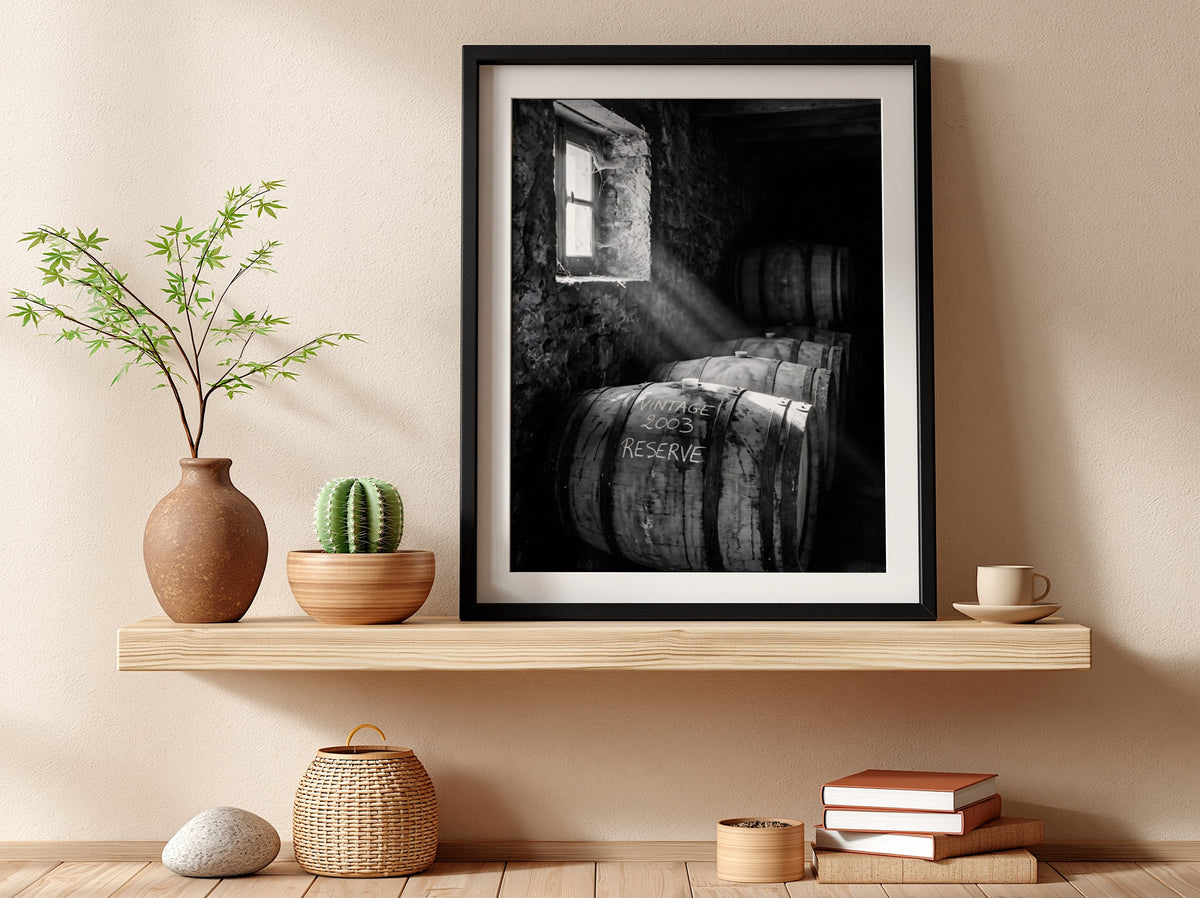 Poster of stacked whiskey barrels in rustic cellar with sunlight illuminating barrels and walls