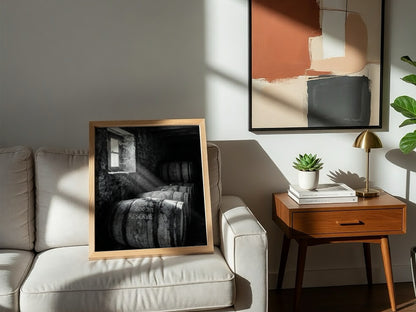 Poster of stacked whiskey barrels in rustic cellar with sunlight illuminating barrels and walls