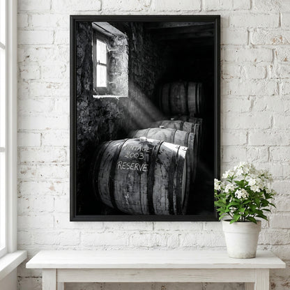 Poster of stacked whiskey barrels in rustic cellar with sunlight illuminating barrels and walls