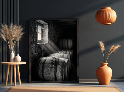 Poster of stacked whiskey barrels in rustic cellar with sunlight illuminating barrels and walls
